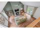 Spacious living room with a fireplace, vaulted ceilings, and outdoor access to the backyard at 1870 Shoreline Trce, Grayson, GA 30017