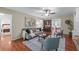Comfortable living room with hardwood floors, stylish furniture, and an open view to the dining area at 1870 Shoreline Trce, Grayson, GA 30017