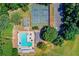 A lovely aerial view featuring a community pool and tennis courts, perfect for active residents at 1870 Shoreline Trce, Grayson, GA 30017