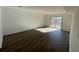 Finished basement area with wood-look flooring and a sliding glass door leading to the outside at 3417 Hollow Tree Dr, Decatur, GA 30034