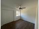 Inviting bedroom featuring wood-look floors, a ceiling fan, a window, and a closet, maximizing space and comfort at 3417 Hollow Tree Dr, Decatur, GA 30034