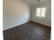 Cozy bedroom with wood-look floors and natural light, offering a comfortable and inviting space at 3417 Hollow Tree Dr, Decatur, GA 30034