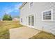 View of backyard showing patio, grass and white siding on home at 4872 Antelope Cv, Atlanta, GA 30349