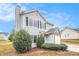 Attractive gray home with black shutters and a stone-accented attached garage at 4872 Antelope Cv, Atlanta, GA 30349