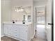 Spacious bathroom featuring a double vanity and large mirror at 690 Avalon Forest Dr, Lawrenceville, GA 30044