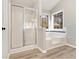 Stylish bathroom with glass shower and deep soaking tub at 690 Avalon Forest Dr, Lawrenceville, GA 30044