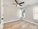 Relaxing bedroom with ceiling fan, light walls, and two windows overlooking the yard at 690 Avalon Forest Dr, Lawrenceville, GA 30044