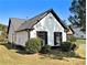 Picture of the side of a well-maintained home with green grass and lush shrubs at 690 Avalon Forest Dr, Lawrenceville, GA 30044