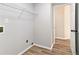 Convenient laundry room with shelving and easy access at 690 Avalon Forest Dr, Lawrenceville, GA 30044