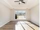 Open-concept living room bathed in sunlight with large window overlooking front yard at 690 Avalon Forest Dr, Lawrenceville, GA 30044