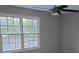 Bedroom with large windows and a ceiling fan at 1947 Kensington High Sw St, Lilburn, GA 30047