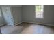 Comfortable bedroom with neutral walls, natural light, and a ceiling fan at 1947 Kensington High Sw St, Lilburn, GA 30047