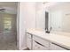 Clean bathroom featuring a vanity, large mirror, and new black faucet at 372 Rustic Ridge Cir, Lawrenceville, GA 30043