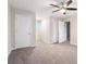 Spacious bedroom with fan and neutral gray carpet and walls at 372 Rustic Ridge Cir, Lawrenceville, GA 30043