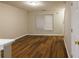 A living room featuring hard wood floors, a window and a door at 612 Stadler Pointe, Mcdonough, GA 30253