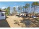 Large backyard with a covered patio, perfect for outdoor entertaining, surrounded by a fence for privacy at 1243 Old Villa Rica Rd, Dallas, GA 30157