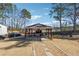 Backyard gazebo area with a grill and outdoor seating, perfect for entertaining at 1243 Old Villa Rica Rd, Dallas, GA 30157