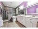 Bathroom featuring dual vanities, separate shower, and soaking tub at 1243 Old Villa Rica Rd, Dallas, GA 30157