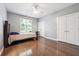 Spacious bedroom features a large window, ample closet space, and wood floors at 1243 Old Villa Rica Rd, Dallas, GA 30157