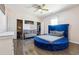 Unique bedroom with a round blue bed, wood floors, and closet space at 1243 Old Villa Rica Rd, Dallas, GA 30157