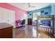 Bedroom with desk and bunk beds, colorful walls and wood floor at 1243 Old Villa Rica Rd, Dallas, GA 30157