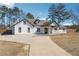 Attractive home featuring a long concrete driveway and a well-maintained lawn at 1243 Old Villa Rica Rd, Dallas, GA 30157