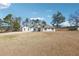 Inviting two-story home with a well-maintained lawn and beautiful architectural detailing at 1243 Old Villa Rica Rd, Dallas, GA 30157