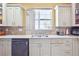 Close up view of the modern kitchen with stainless steel sink, appliances, and granite countertops at 1243 Old Villa Rica Rd, Dallas, GA 30157