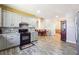 Open floor plan with modern kitchen, dining room, and living area, great for entertaining at 1243 Old Villa Rica Rd, Dallas, GA 30157