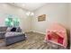 Cozy living room with large windows and a comfortable sofa with decor at 1243 Old Villa Rica Rd, Dallas, GA 30157