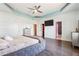 Main bedroom with TV, tray ceilings, ensuite bath and walk-in closet at 1243 Old Villa Rica Rd, Dallas, GA 30157