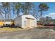 Spacious outbuilding with a large roll-up door and a parking pad at 1243 Old Villa Rica Rd, Dallas, GA 30157