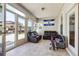 Cozy sunroom with tile flooring, comfortable seating, and natural light at 1243 Old Villa Rica Rd, Dallas, GA 30157