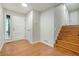 Bright foyer with hardwood floors, white trim, and staircase leading to upper level at 2940 Leah Ln, Douglasville, GA 30135