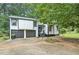 Charming two-story home featuring a two-car garage and well-maintained landscaping at 2940 Leah Ln, Douglasville, GA 30135