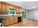 Functional kitchen featuring wood cabinets, black appliances, and hardwood floors at 2940 Leah Ln, Douglasville, GA 30135