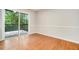 Cozy room with hardwood floors, neutral walls, and sliding glass doors to the outside deck at 2940 Leah Ln, Douglasville, GA 30135