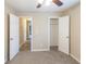 Neutral bedroom with open doors to a closet and hallway, featuring a ceiling fan at 116 Black Oak Ct, Stockbridge, GA 30281