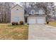 Charming two-story home with attached two-car garage and a well-maintained front lawn at 116 Black Oak Ct, Stockbridge, GA 30281