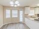 Bright kitchen with bay windows, modern lighting, granite countertops, and new stainless steel appliances at 116 Black Oak Ct, Stockbridge, GA 30281