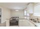 Updated kitchen featuring stainless steel stove top, granite countertops, and lots of natural light at 116 Black Oak Ct, Stockbridge, GA 30281