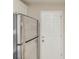 Stainless steel refrigerator with a white door leading to the outside at 116 Black Oak Ct, Stockbridge, GA 30281