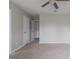 Comfortable bedroom showcasing soft carpet and neutral walls at 2172 Red Rose Ln, Loganville, GA 30052