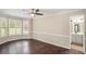 Spacious main bedroom featuring hardwood floors, neutral paint, and an en-suite bathroom with double vanity at 4902 Cedar Se Ct, Conyers, GA 30094