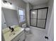 Practical bathroom with standard vanity and a shower/tub combo at 7910 Tintern Trce, Duluth, GA 30097