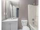 Bathroom with vanity, a standard toilet, and a shower-tub combination at 8740 Parliament Pl, Jonesboro, GA 30238