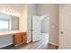 Bathroom featuring vanity, mirror, and view of bedroom at 11143 Aliyah Dr, Hampton, GA 30228