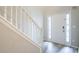 Entryway with white stairway, light gray walls, and a front door with sidelights at 11143 Aliyah Dr, Hampton, GA 30228