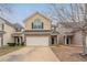 Charming two-story home featuring a brick facade, attached garage, and well-maintained landscaping at 11143 Aliyah Dr, Hampton, GA 30228