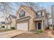 Two-story home featuring a brick facade, attached garage, and covered front porch at 11143 Aliyah Dr, Hampton, GA 30228